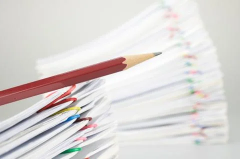 Close up pencil on document have blur pile overload paperwork Stock Photos