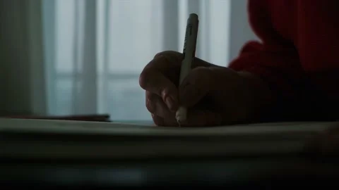 Close-up. Pencil in a woman's hand in front of the window Vídeo Stock 152952782