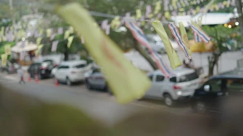 Close up of pennants on a string, with Thailand flag hanging on the street - Stock Footage 219021784