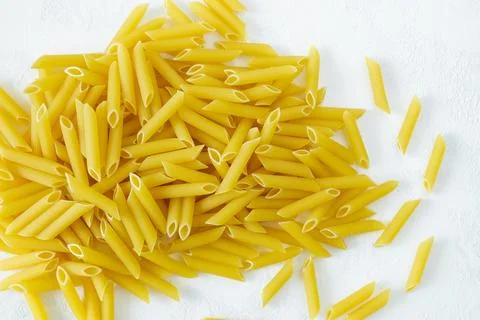 Close-up of penne paste on a light background Stock Photos