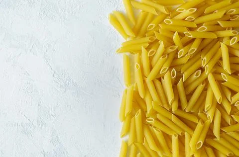 Close-up of penne paste on a light background Stock Photos