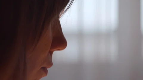 Close-up of a pensive female face Stock Footage 121313626