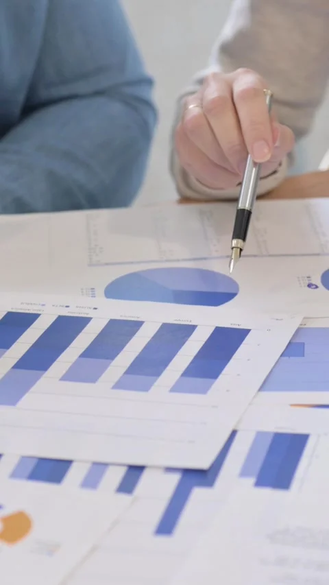 Close Up of People Doing Paperwork, vertical video Video stock 325698123