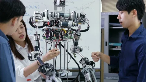 Close-up people fixing robot at laboratory. Stock Footage 95188358