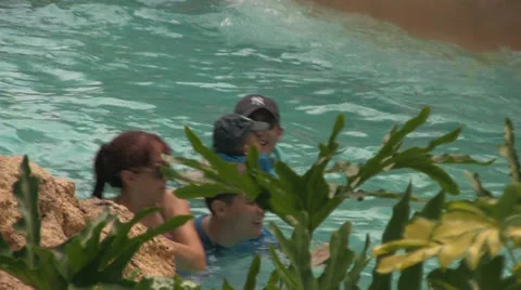 Close-up of People Floating-by in Lazy River at Water Park Stock Footage 24702671