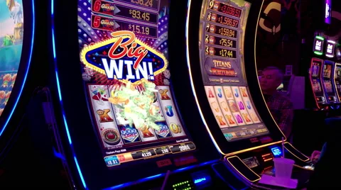 Close up of people got big win for playing slot machineinside Hard Rock Casino Stock Footage 67490524
