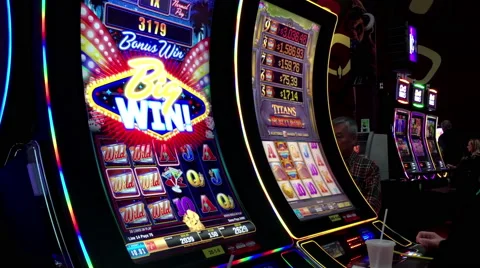 Close up of people got big win for playing slot machineinside Hard Rock Casino Stock Footage