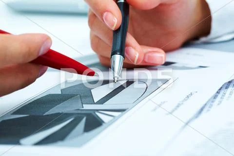 Close-up of people hands during discussion of business-plan Stock Photos