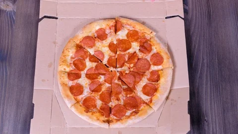Close-up Of People Hands Taking Slices Pizza from food delivery open box. Stock Footage 124608439