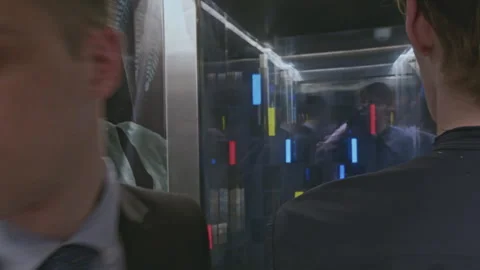 Close up of people inside elevator. Stock clip. People leaving glass walls 库存影片 274408864