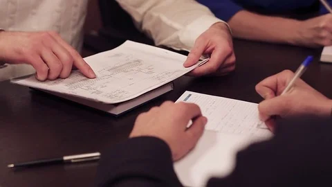 Close-up of people in office working with documents. Stock-Footage 77006768
