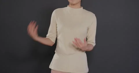 Close up of people talking to the camera, clapping hands, woman in beige top Stock Footage 345570568