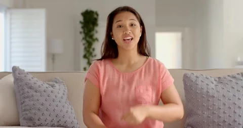 Close up of people talking to the camera, communicating, woman sitting on couch Stock Footage 345800128