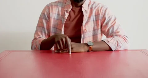 Close up of people talking to the camera, man sitting at red table, wearing Stock Footage 345568001