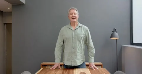 Close up of people talking to the camera, man standing at wooden table with Stock Footage 345569443