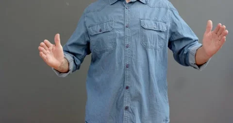 Close up of people talking to the camera, man in denim shirt gesturing with open Stock Footage 345569452
