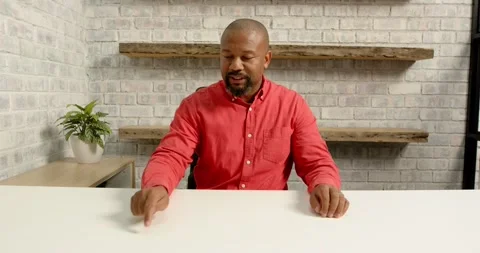 Close up of people talking to the camera, man in red shirt sitting at desk, Stock Footage 345715109