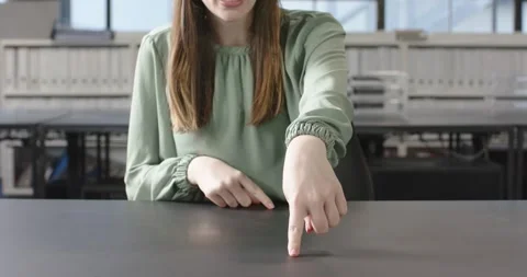 Close up of people talking to the camera, pointing at desk, woman in green Stock Footage 345060606