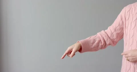 Close up of people talking to the camera, pointing finger in pink sweater, Stock Footage 346026522
