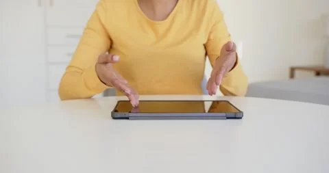 Close up of people talking to the camera, using tablet, woman gesturing with Stock Footage 345567168