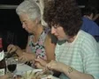 Close up of people talking together over meal on train SD Footage