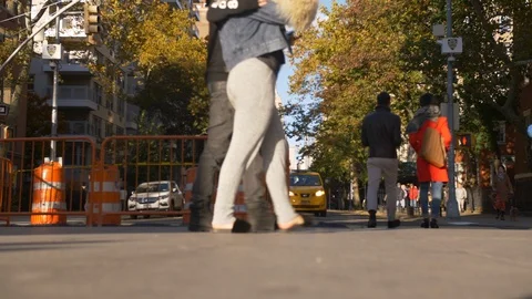 Close Up People Walking Past Orange Traffic Cones In The Heart Of NYC Stock Footage 113884959