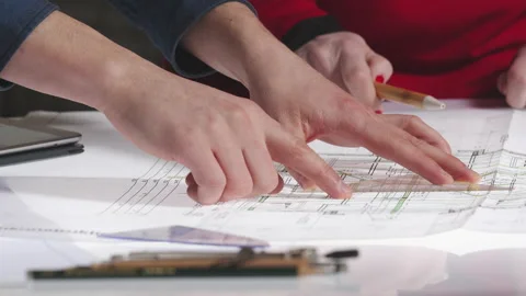 Close-up of people working on architecture plans in office Stock Footage 149242930