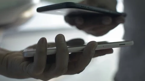 Close up peoples hand using smartphone to scan QR code payment. Stock Footage 149963856