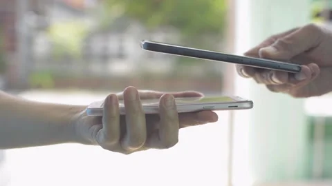 Close up peoples hand using smartphone to scan QR code payment. Stock Footage 149963865