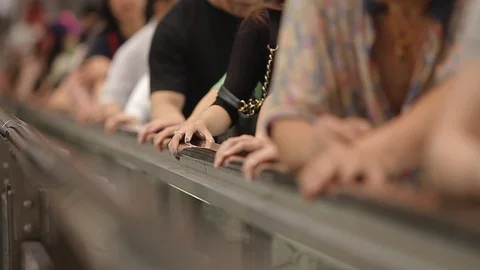 Close-Up of people’s hands moving on a crowded escalator in Hong Kong city Stock Footage 97102793