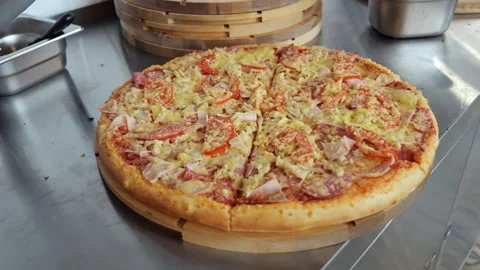 Close-up of pepperoni pizza on a table in a restaurant. Stock Footage 341550470