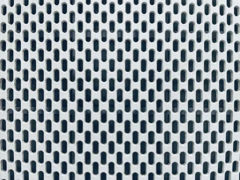 Close-Up of Perforated Metal Sheet with Rounded Rectangular Holes Stock Photos