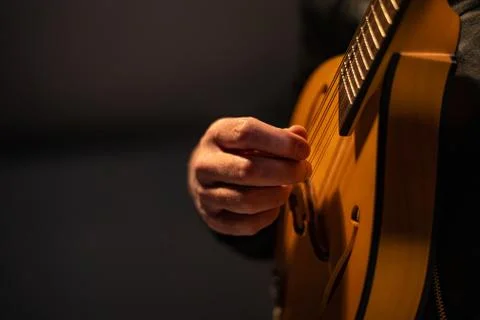 Close up performer plays classical mandolin on stage Stock Photos