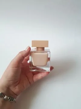 Close-up of perfumed water lying in the hand Stock Photos
