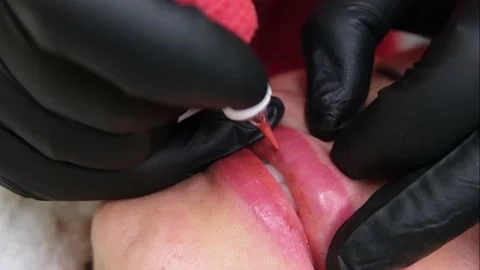Close up of permanent lip makeup. lip tattoo. Video stock 146579681