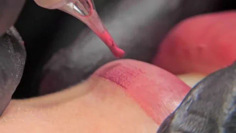 Close-up of a permanent makeup procedure. Macro Stock Footage 200823614