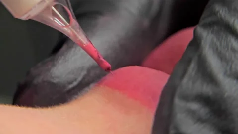 Close-up of a permanent makeup procedure. Macro Stock Footage 200824009