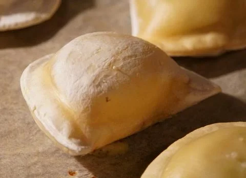 Close up of perogies on a baking tray Stock Photos