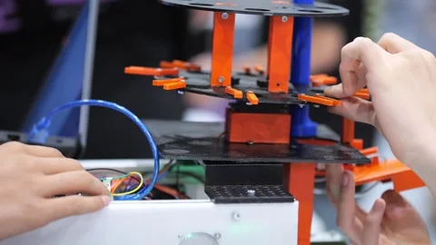 Close-up of person assembling 3D printer parts Stock Footage 345407343
