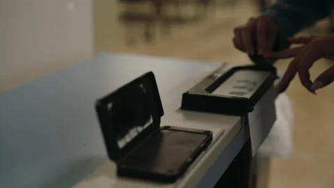 Close-up of a person being fingerprinted using an ink pad for official Stock Footage 337143639
