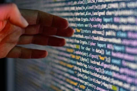 Close-up of a person coding on a computer screen Foto stock