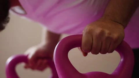 Close up person doing push up exercises over kettlebell or dumbbells Stock Footage 237729260