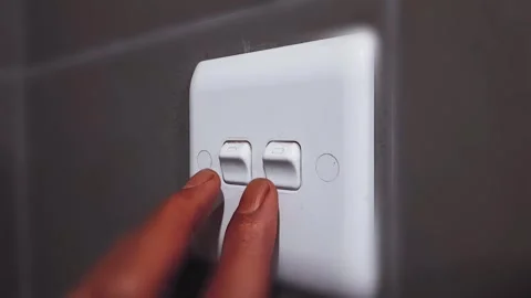 Close-up of a person finger pressing a wall switch to turn off the light. Stock Footage 309607102