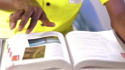 Close up of a Person flipping through book pages. Stock Footage 201316742