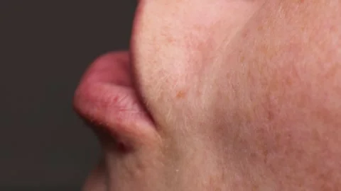 Close-up of person gargling saline solution for sore throat relief Stock Footage 321834335