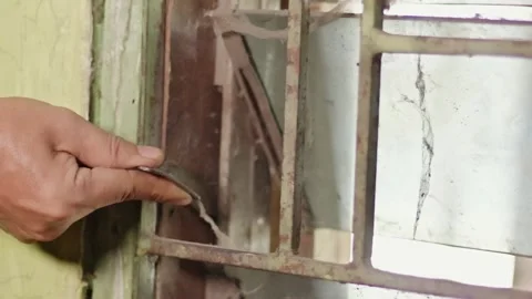 Close Up of Person Hand Opening Old Dusty Glass Window with Rusty Metal Trell 스톡 동영상 335137438