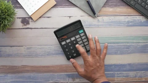 Close up of person hand using calculator for finance and accounting calcula.. Stock Footage 332623608