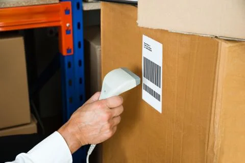 Close-up Person Hands With Barcode Scanner Scanning Label On Box Stock Photos
