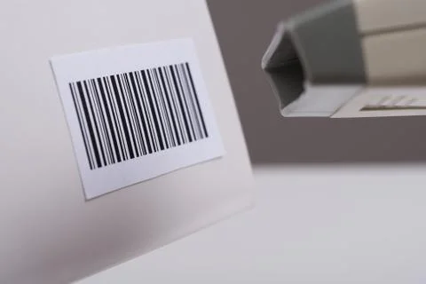 Close-up Of Person Hands Using Barcode Scanner To Scan A Barcode On A Box Stock Photos