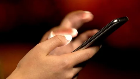 Close-up of person hands using smartphone or cell phone Tapping scrolling Stock-Footage 336248982